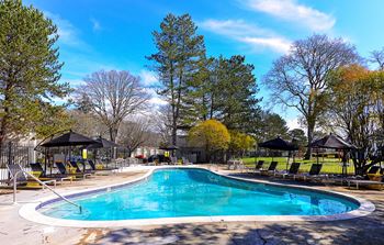 Swimming pool with chairs around